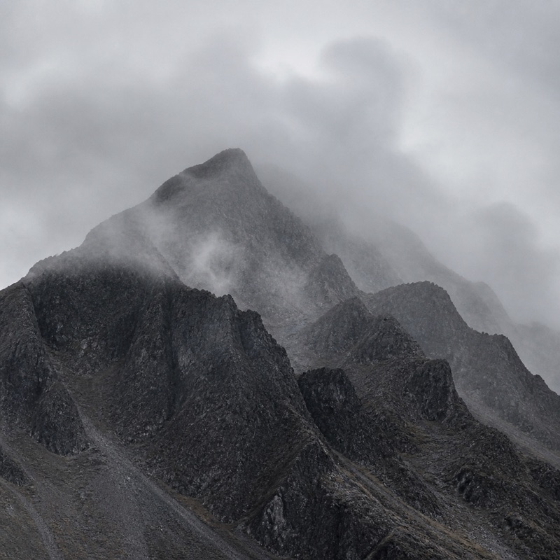 A mountain landscape softened by mist